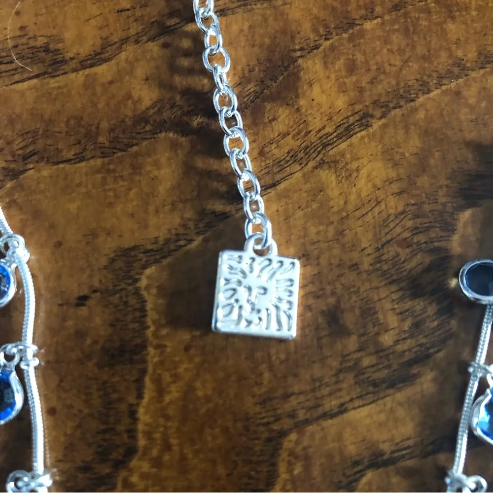 Vintage Anne Klein lion triple strand framed blue crystal dangle necklace
